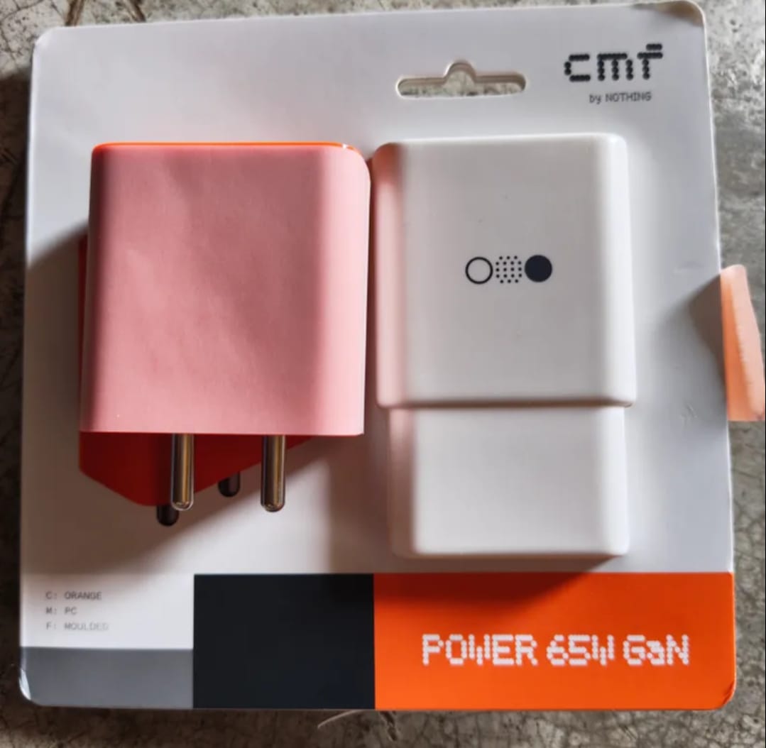 CMF Power 65W GaN charger is an ultra-compact, 3-port (2 USB-C + 1 USB-A) fast charger with universal compatibility and intelligent power distribution for optimal speed. Featuring 8 safety protections, it delivers rapid, safe charging for phones, tablets, earbuds, and notebooks--charging Nothing Phone (2) to 50% in 25 minutes. Features: 65 W GaN ultra fast charger 3 Port : 2 USB Type C and 1 USB A Port Ultra compact and portable Output current : 3A Universal voltage 8 protection technologies to ensure safest charging even at peak output One to Power All: 3-in-1 compact design 65W GaN ultra-fast charging wide compatibility. Universal compatibility:Your new travel companion. The CMF Power 65 GaN works with all major fast charging protocols. Compatible with MFI-certified cables, guaranteeing optimal performance accross a range of tech products. All-round protection: Rest assured, we've gone the extra mile to protect your devices. With safeguards against short circuits, overheating, excessive currents, high voltage, low voltage, interference, as well as flame retardant protection for the charger's outer shell. Charge more, carry less : Less is always more with the CMF power 65W GaN charger. Small, portables and beyond powerful, it's your new go-to. From phones and tablets to earbuds and notebooks, its two USB-C ports and USB-A port have you covered. Intelligent power distribution:Ensures the optima charging speed for all devices. 65W Fast Charging: Powered by the latest GaN tech for the fastest, safest and most energy efficient charging experience. Featuring robust thermal conductivity and high-tempreture resistance. Works hand-in-hand with a chip that can intelligently adjust voltage and current. The result is a powerhouse that can charge the Nothing Phone (2) smartphone up to 50 percent within 25 minutes.